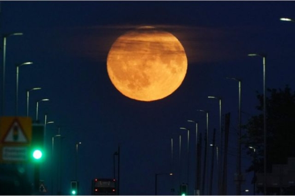 The supermoon rises over Seaton Sluice in Northumberland on 2 July