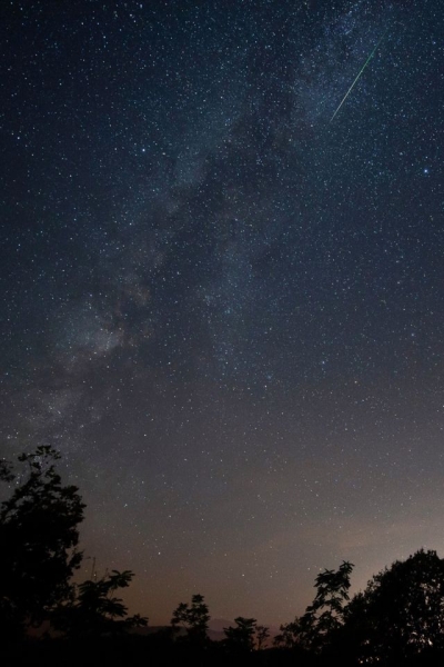 A shooting star is seen during the Perseids meteor shower in Comillas, Cantabria, Spain